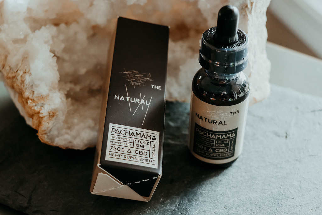 Hemp oil bottle beside its box